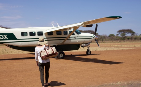 A lady enjoying a private charter with Safari Air Link on a Cessna grand caravan